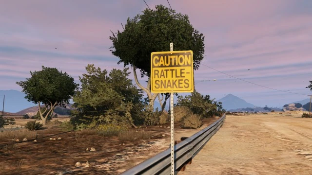 The Snake billboard — probably another recycled visual gag where even in-universe ads feel like stock asset flips, fitting Rockstar's meta-commentary on cutting corners.