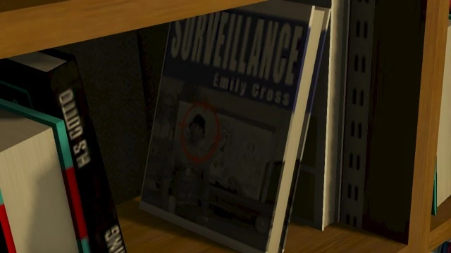 THERE IT IS. In Lester's house, the 'Surveillance' book literally has CJ on the cover. The conspiracy freak is watching a former protagonist. Peak Rockstar.